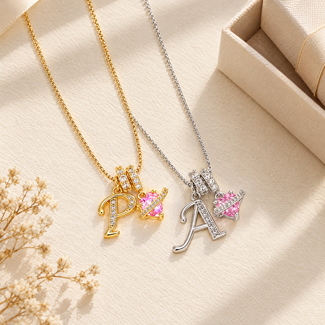 Gold and silver initial letter necklaces with pink heart charm